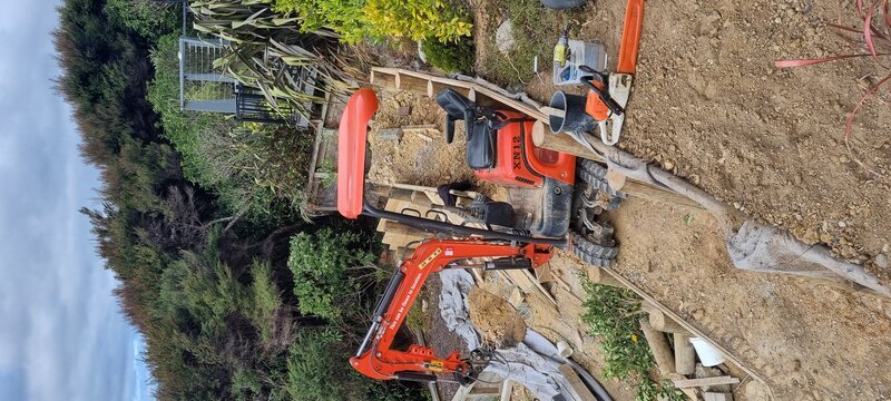 Excavator for retaining wall post holes - digger hire Kapiti