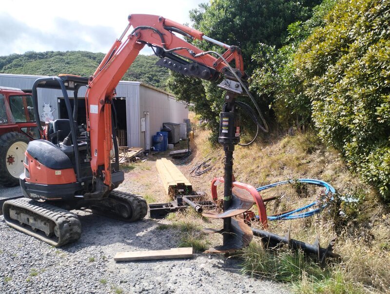 Auger attachment for post hole drilling - earthworks